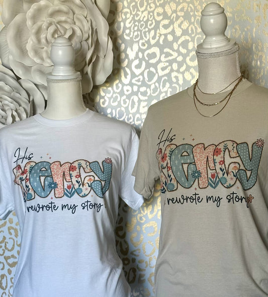 "His Mercy rewrote my story" White OR Sand tee
